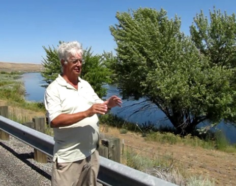 Peter Beach tells Whitcomb about how the light flew up from this tree on night, by the Yakima River in Washington